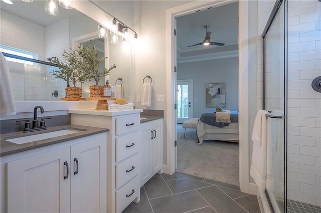 17372 S Kaw St, Olathe, KS 66062 - ensuite bathroom featuring vanity, tile patterned flooring, a stall shower, and ceiling fan