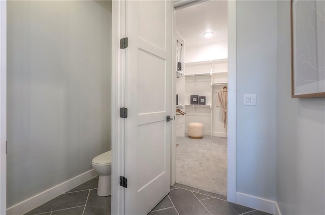 17372 S Kaw St, Olathe, KS 66062 - bathroom with toilet, tile patterned flooring, and baseboards