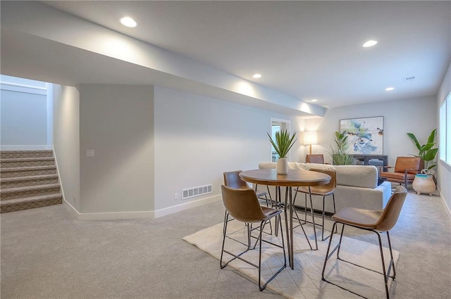 17372 S Kaw St, Olathe, KS 66062 - dining area with light carpet, baseboards, stairway, and recessed lighting