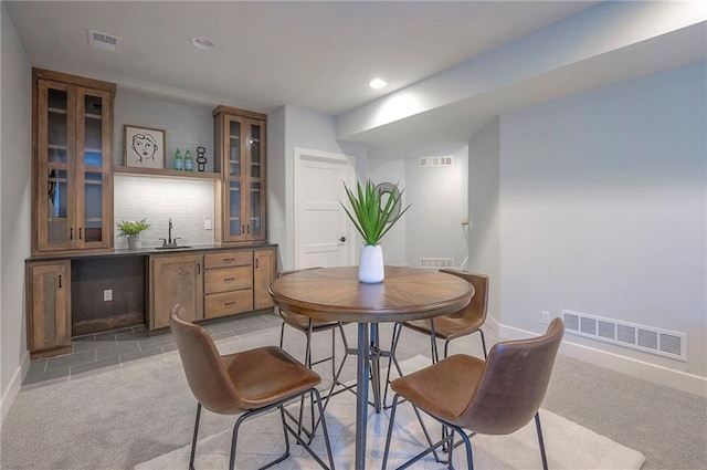 17372 S Kaw St, Olathe, KS 66062 - dining space with wet bar, baseboards, recessed lighting, and light colored carpet
