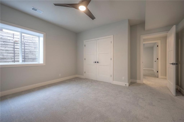 17372 S Kaw St, Olathe, KS 66062 - unfurnished bedroom featuring carpet, a closet, baseboards, and ceiling fan