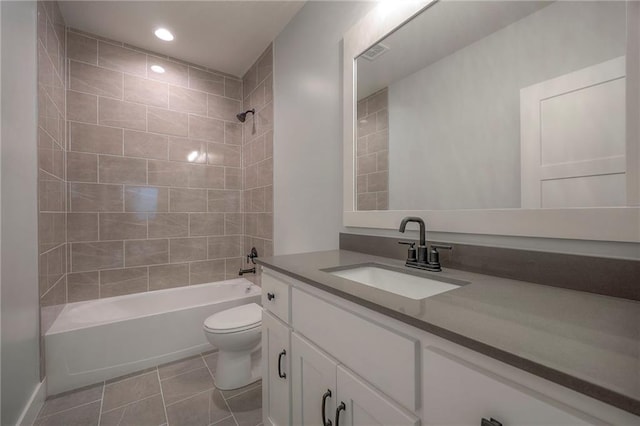 17372 S Kaw St, Olathe, KS 66062 - bathroom with vanity, toilet, tub / shower combination, tile patterned flooring, and recessed lighting