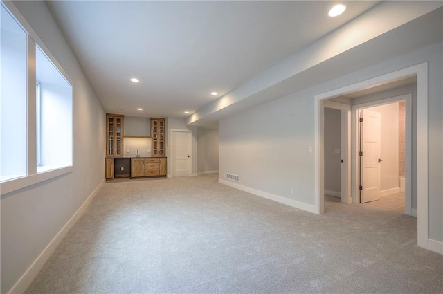 17372 S Kaw St, Olathe, KS 66062 - unfurnished living room featuring recessed lighting, baseboards, light carpet, and bar area