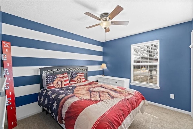 bedroom with carpet floors, ceiling fan, and baseboards