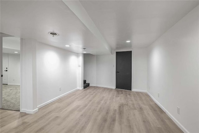 interior space with light wood-style flooring, visible vents, baseboards, and recessed lighting