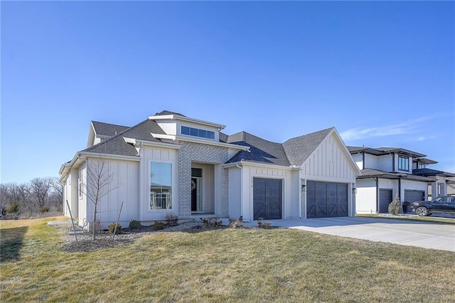 view of front facade with a garage, concrete driveway, board and batten siding, and a front yard