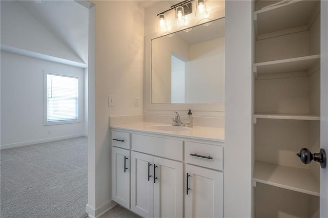 bathroom featuring vanity and baseboards