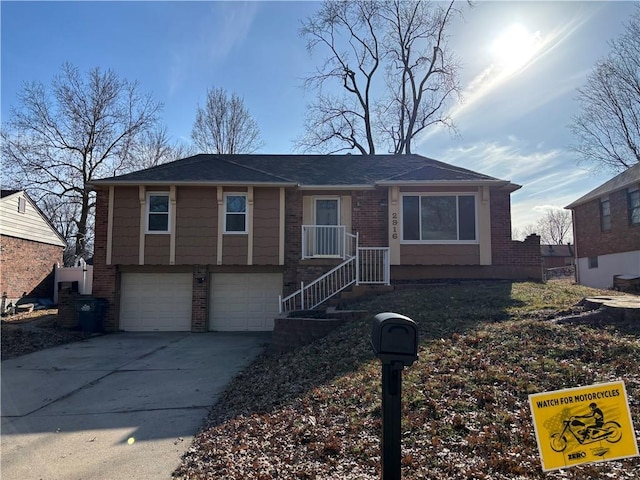 view of front of property featuring concrete driveway, brick siding, and an attached garage