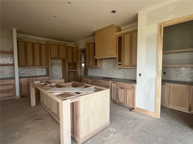 12604 W 170th St, Overland Park, KS 66221 - kitchen with decorative backsplash, a center island, and dark countertops