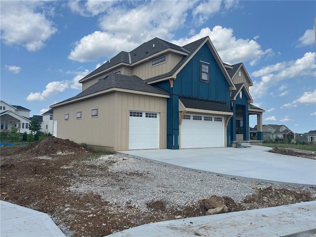12604 W 170th St, Overland Park, KS 66221 - view of side of home featuring board and batten siding, concrete driveway, a shingled roof, an attached garage, and a residential view