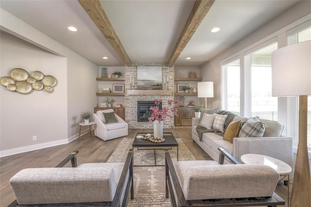 12604 W 170th St, Overland Park, KS 66221 - living area with wood finished floors, beamed ceiling, a fireplace, and recessed lighting