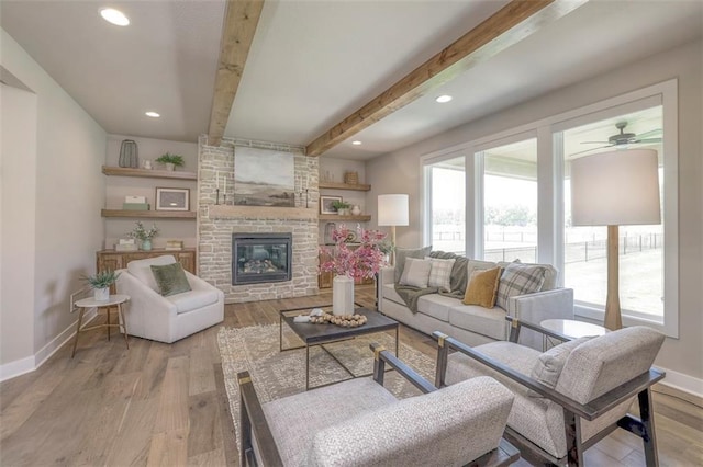 12604 W 170th St, Overland Park, KS 66221 - living area with beam ceiling, wood finished floors, a ceiling fan, a large fireplace, and recessed lighting