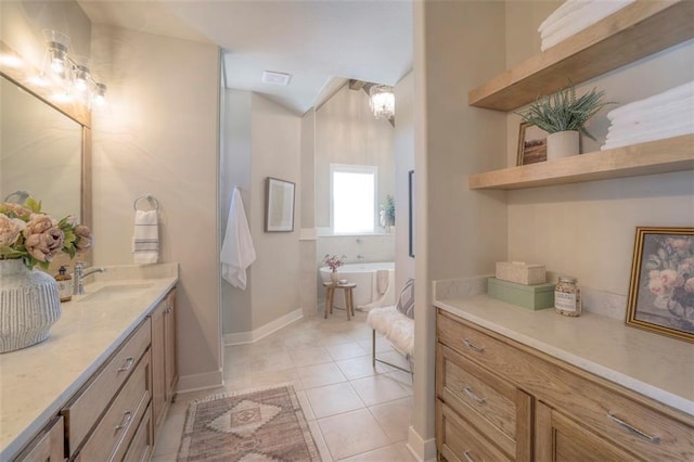 12604 W 170th St, Overland Park, KS 66221 - bathroom with a freestanding bath, vanity, and tile patterned floors