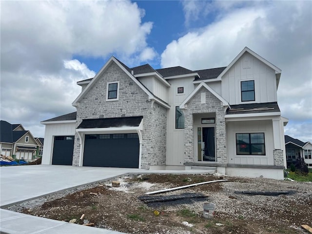 12604 W 170th St, Overland Park, KS 66221 - view of front of property with stone siding, board and batten siding, concrete driveway, a shingled roof, and an attached garage