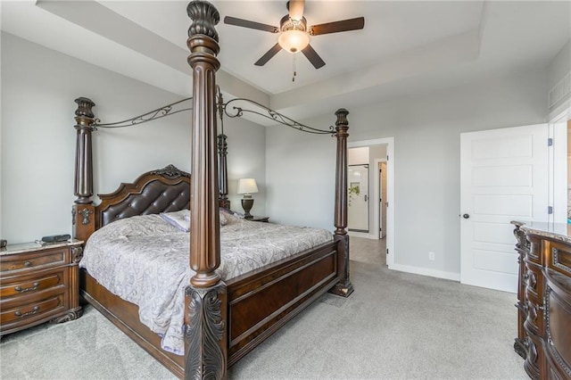 bedroom with light carpet, ceiling fan, and baseboards