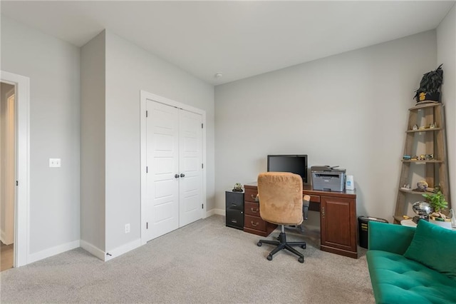 home office featuring carpet and baseboards