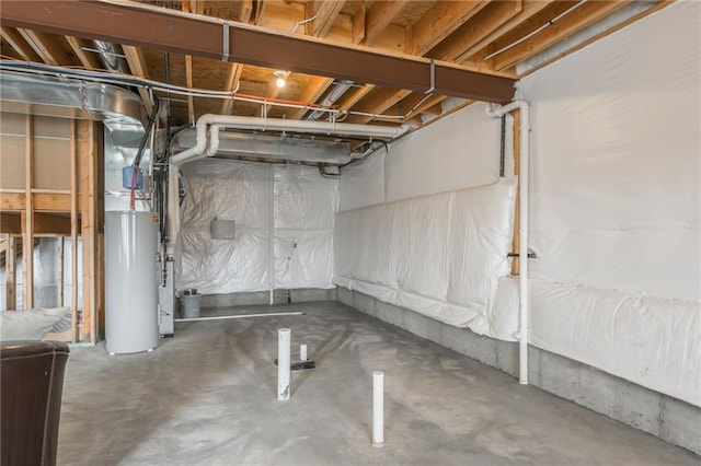 unfinished basement featuring gas water heater