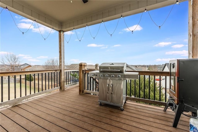 wooden deck with grilling area