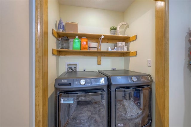 washroom featuring laundry area and independent washer and dryer