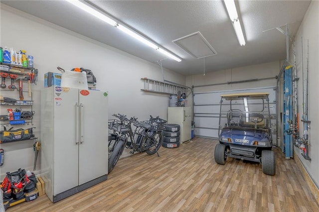 garage with freestanding refrigerator