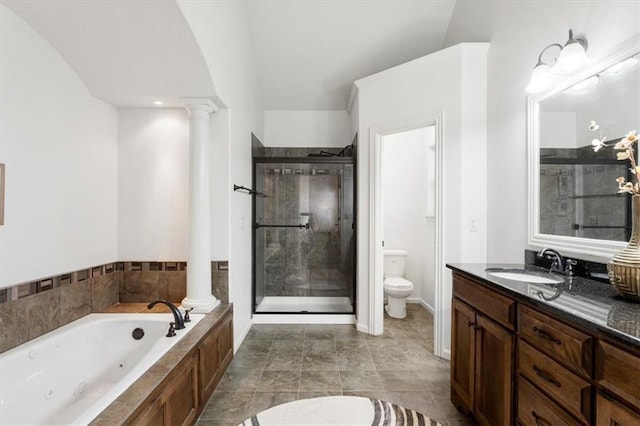 full bath featuring a stall shower, a whirlpool tub, decorative columns, and toilet