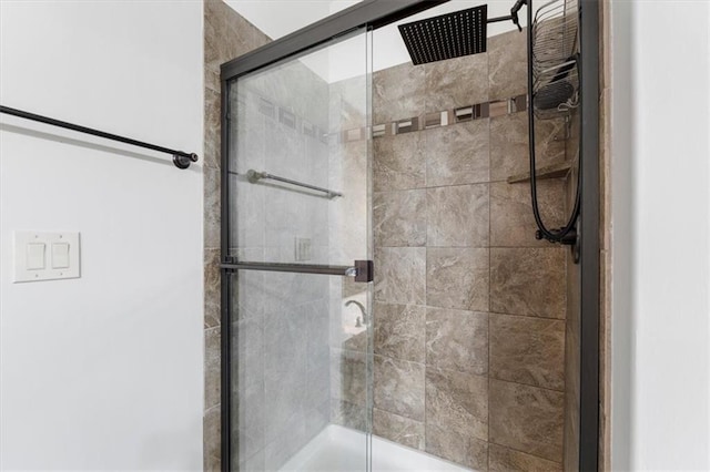 bathroom with a shower stall