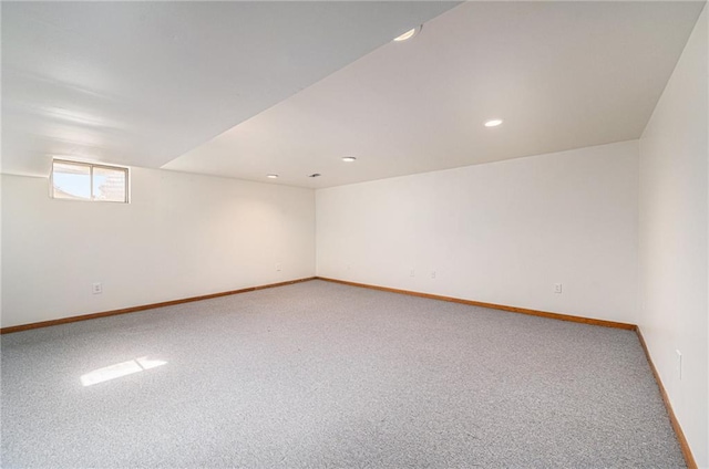carpeted spare room featuring recessed lighting and baseboards
