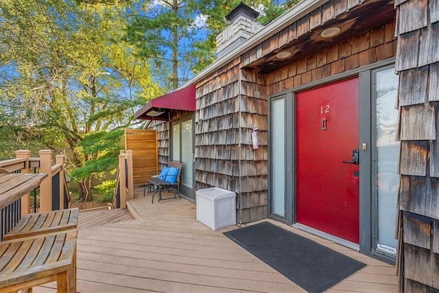 doorway to property featuring a deck