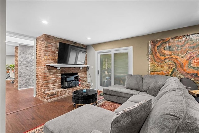 living area with wood finished floors and recessed lighting