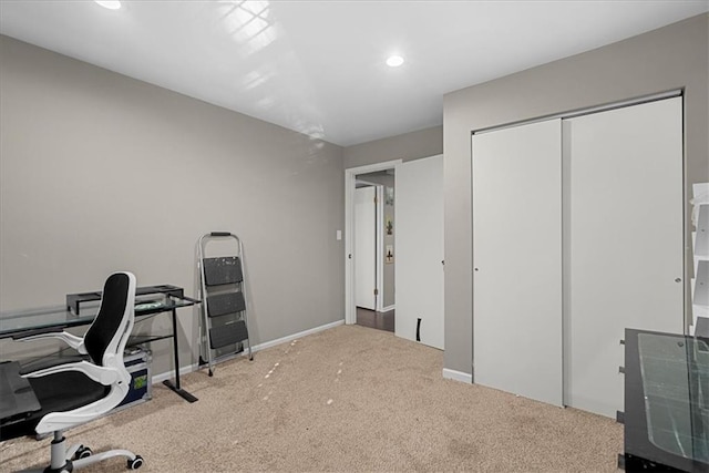 carpeted office space with baseboards and recessed lighting