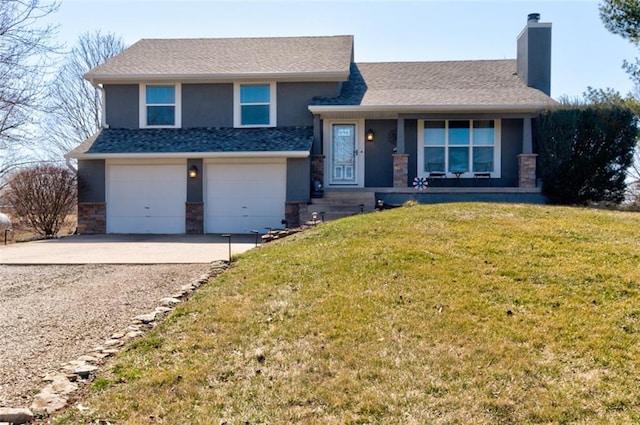 tri-level home featuring a front lawn, driveway, stone siding, an attached garage, and a chimney