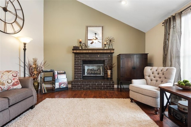 living area featuring wood-type flooring and vaulted ceiling