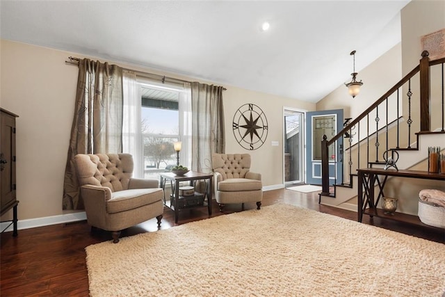 sitting room featuring dark wood-type flooring, lofted ceiling, recessed lighting, baseboards, and stairs