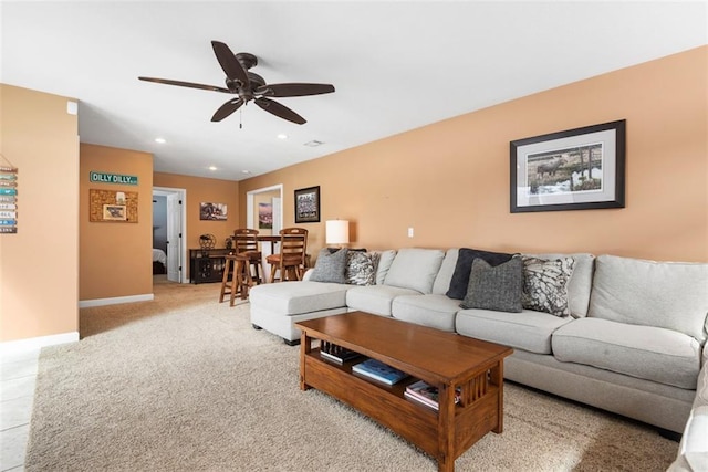 living room featuring light carpet, recessed lighting, baseboards, and ceiling fan