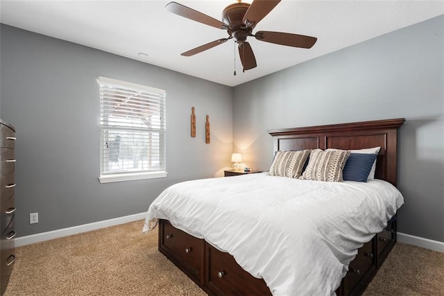 bedroom featuring a ceiling fan, baseboards, and light carpet