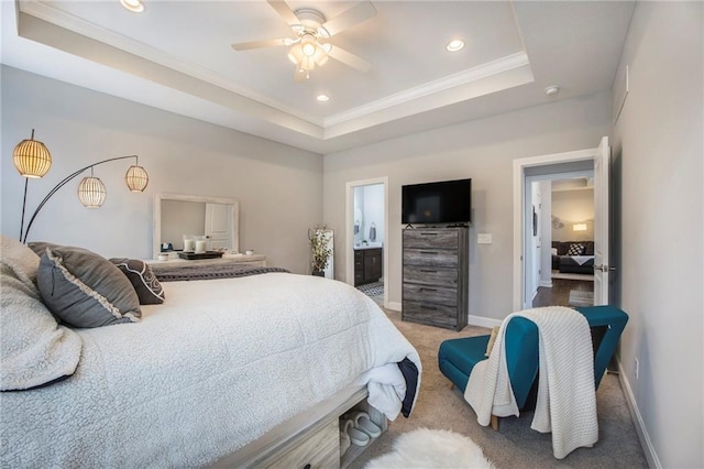 bedroom featuring baseboards, carpet, a tray ceiling, crown molding, and recessed lighting