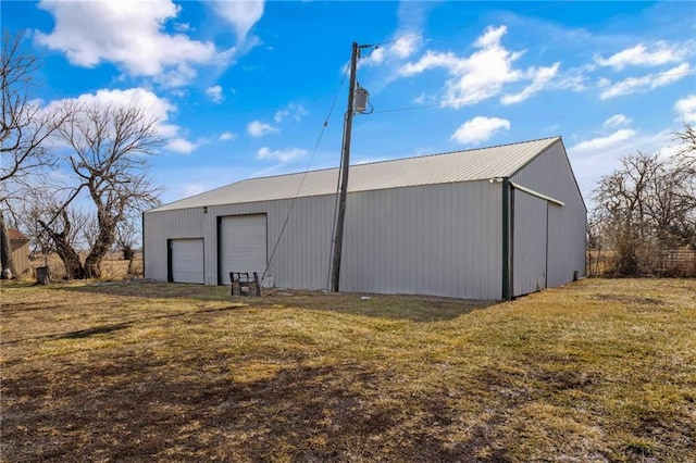 view of pole building with a yard