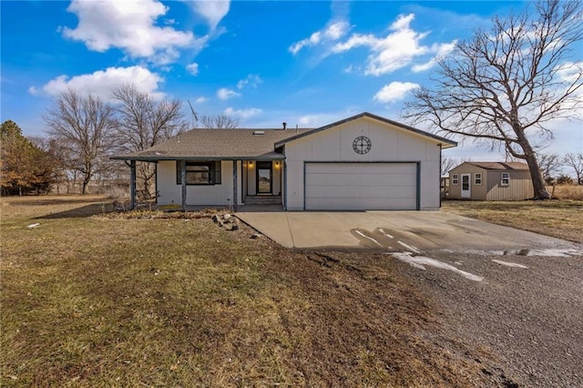 ranch-style home with an attached garage, concrete driveway, and a front lawn