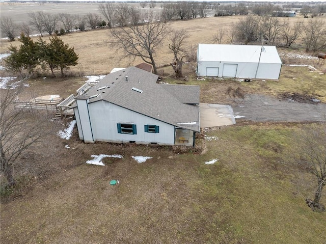 birds eye view of property with a rural view