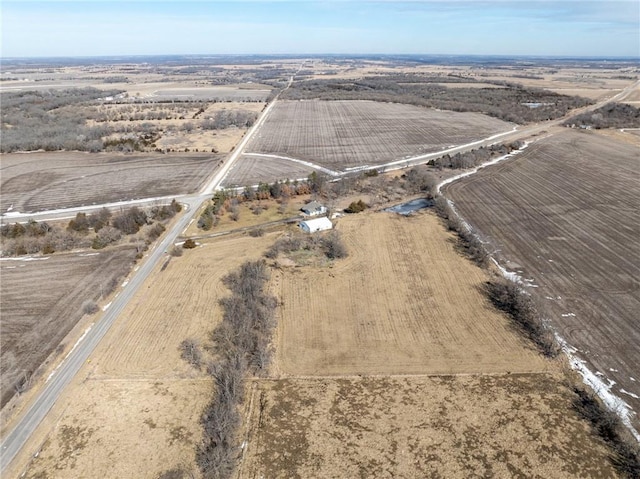 birds eye view of property featuring a rural view