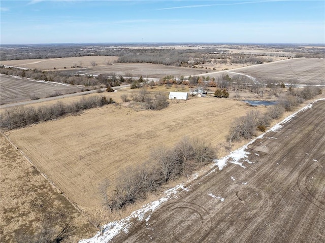 birds eye view of property with a rural view