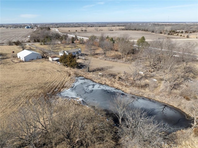 drone / aerial view featuring a water view and a rural view