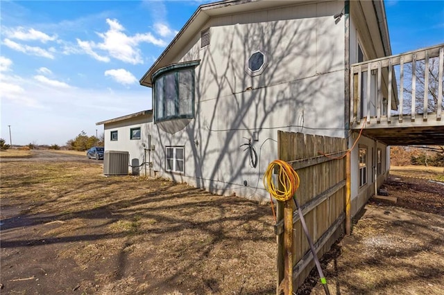 view of side of property with central AC unit