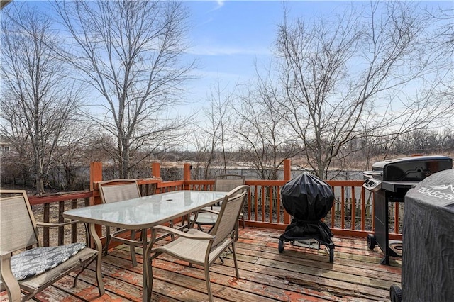 wooden deck with outdoor dining space