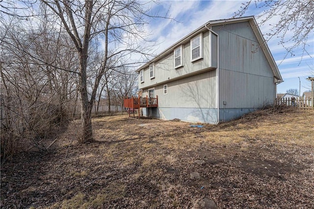 view of property exterior featuring a deck