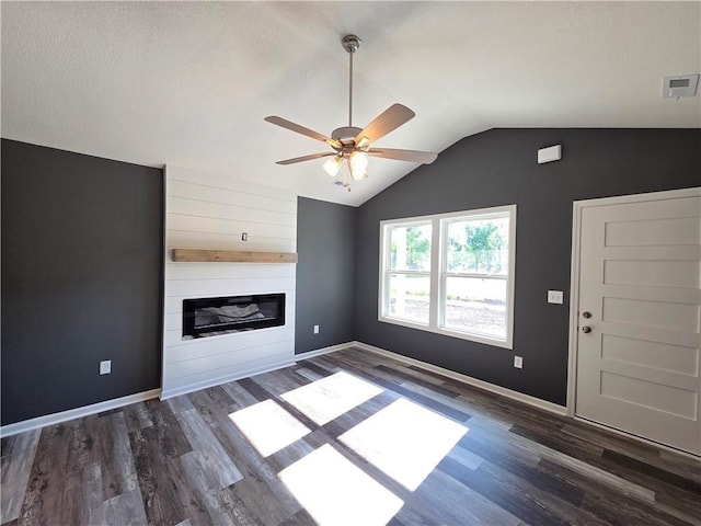 540 N Lexington St, Adrian, MO 64720 - unfurnished living room featuring vaulted ceiling, a ceiling fan, a fireplace, wood finished floors, and baseboards