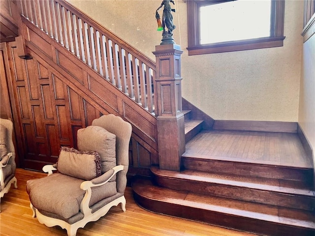 staircase featuring wood finished floors