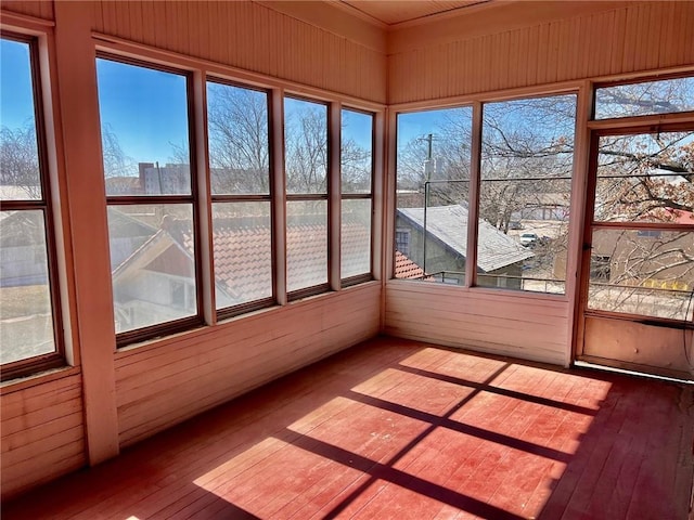 unfurnished sunroom featuring a wealth of natural light