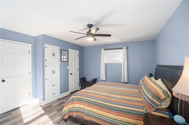 bedroom featuring ceiling fan and wood finished floors