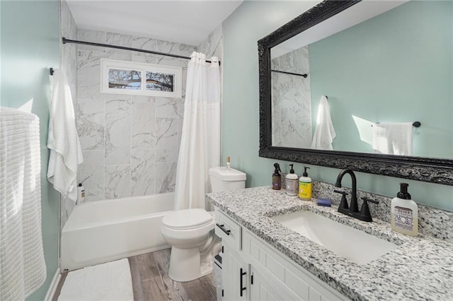 bathroom with vanity, shower / tub combo, wood finished floors, and toilet